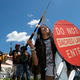An Apache activist dancer performs in a rally to save the Oak Flat area, in front of the U.S. Capitol.